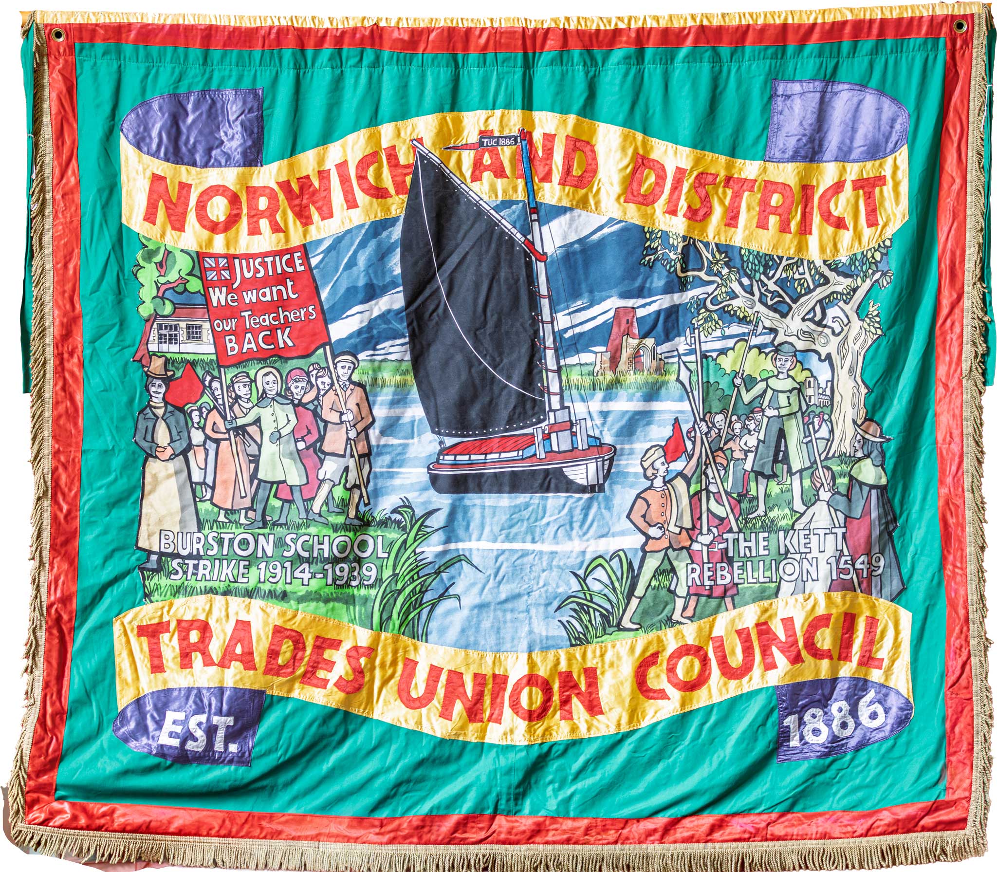 The Norwich & District Trades Union Council banner — Burston School Strike, Kett's Rebellion, and a Norfolk wherry, with the motto Est. 1886